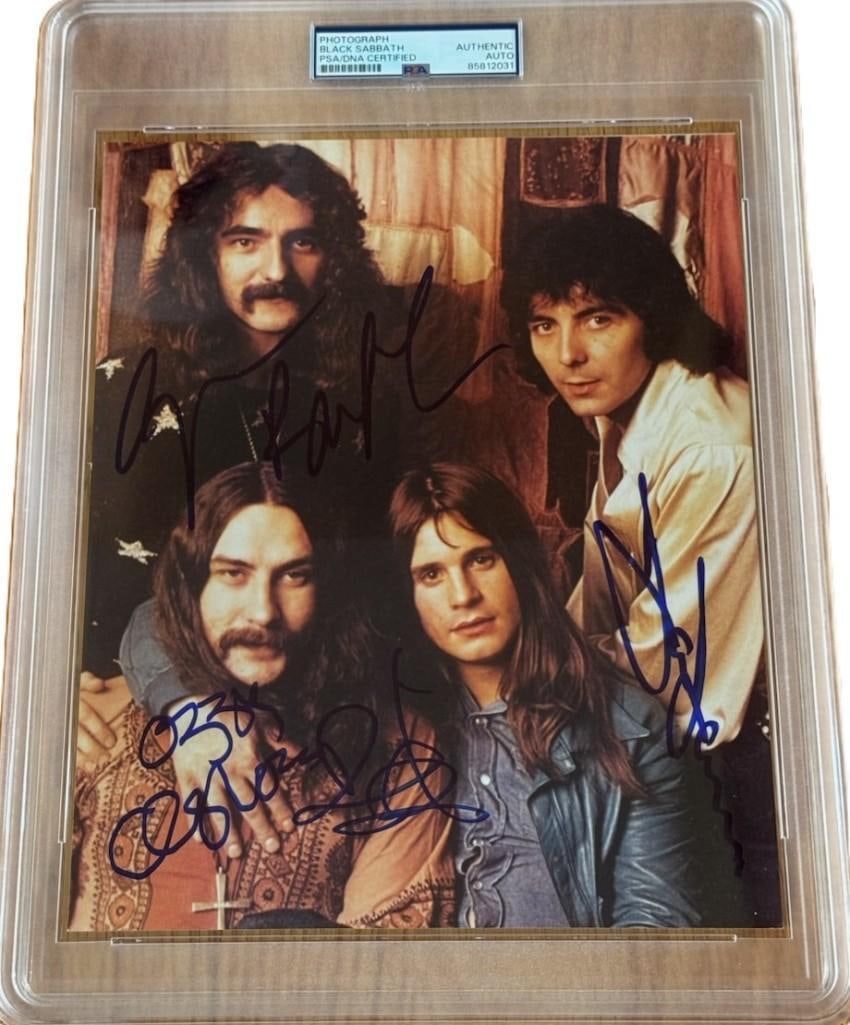 Black Sabbath Group Signed 8" x 10" Photo (4 Sigs) (PSA/DNA & Beckett Authentication): Color 8" x 10" photo signed in blue felt tip marker by Black Sabbath band members Ozzy Osbourne, Geezer Butler, Tony Iommi, and Bill Ward. Signatures are graded Gem Mint 10. In fine condition.