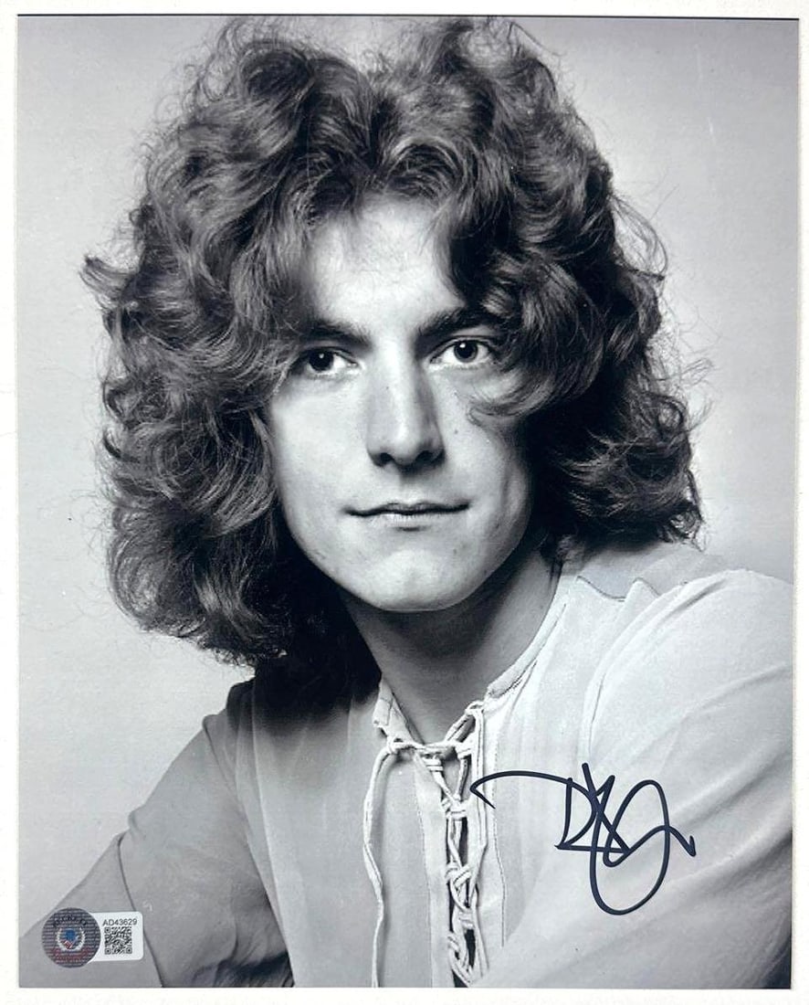 Led Zeppelin: Robert Plant Signed 10" x 8" Photo (Beckett Authentication): Black-and-white 10" x 8" photo signed in black felt tip marker by Led Zeppelin band member Robert Plant. In fine condition. Authenticated by Beckett, with their official hologram affixed to the front