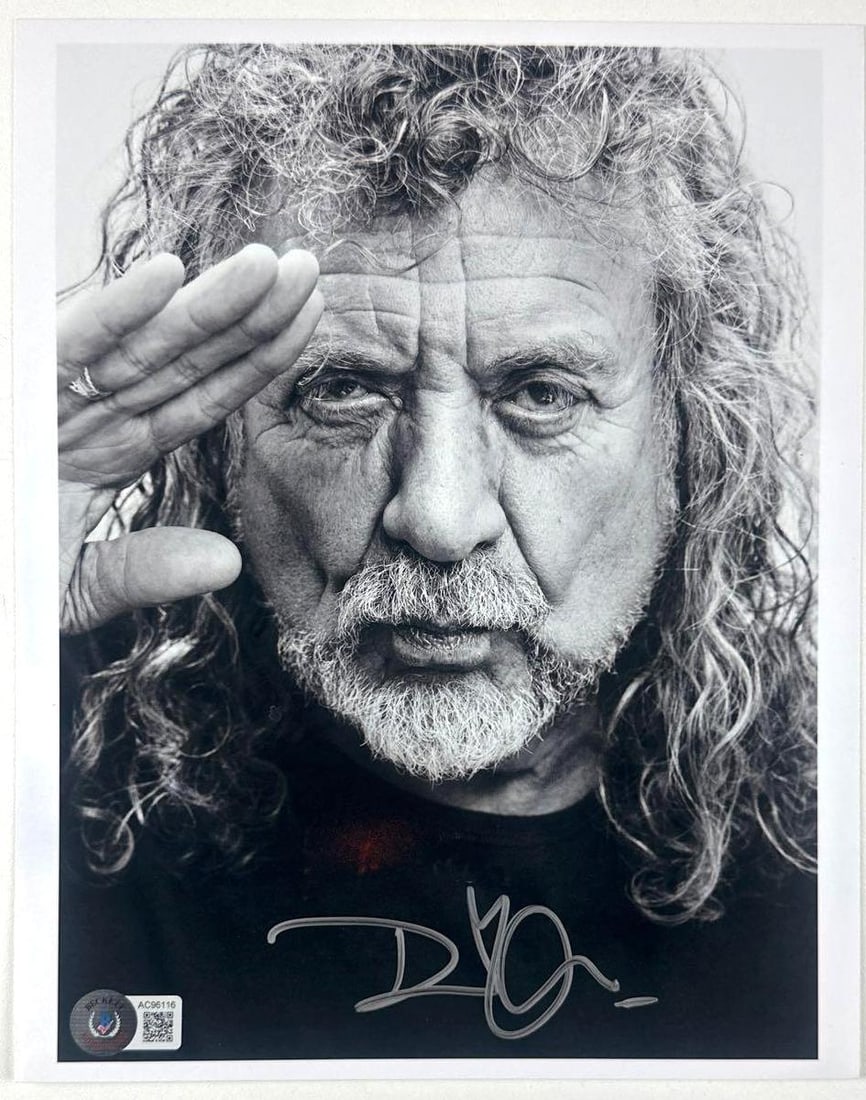 Led Zeppelin: Robert Plant Signed 10" x 8" Photo (Beckett Authentication): Black-and-white 10" x 8" photo signed in silver felt tip marker by Led Zeppelin band member Robert Plant. In fine condition. Authenticated by Beckett and accompanied by a full LOA (#AC96116).