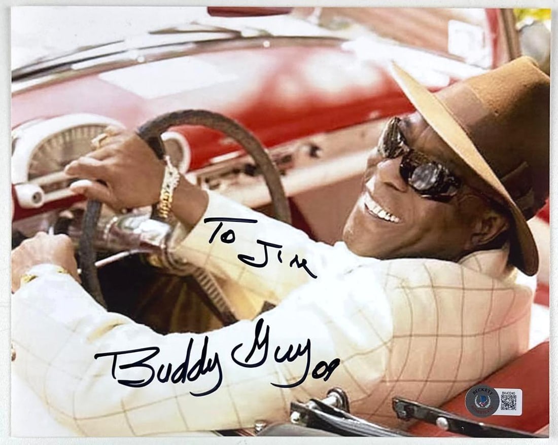 Buddy Guy Signed 8" x 10" Photo (Beckett Authentication): Color 8" x 10" photo signed in black felt tip marker by musician Buddy Guy, who also inscribed "To Jim" before his signature. In fine condition. Authenticated by Beckett, with their official hologram