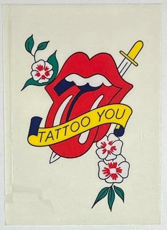 The Rolling Stones "Tattoo You" 1981 Vinyl Sticker (Chip Rachlin Collection): Color 7" x 5" "Tattoo You" 1981 vinyl sticker inspired by the Rolling Stones "Tattoo You" album and band logo artwork. In fine condition. Provenance: From the personal collection of music industry exe