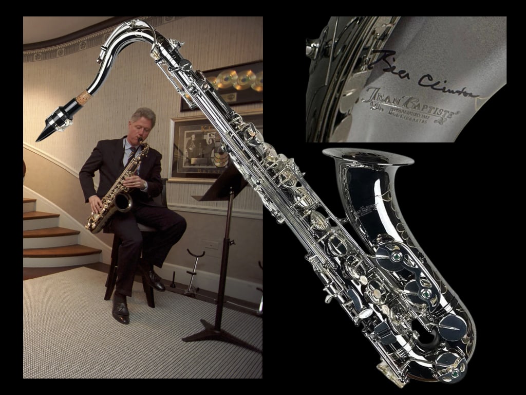 President Bill Clinton Signed Tenor Saxophone (Donated by Clinton, 2012 NYC Charity Event): Exceptional silver Jean Baptiste tenor saxophone, signed prominently on the bell in black felt tip marker by Bill Clinton, 42nd President of the United States. Measuring approximately 30.5" x 11.5" x
