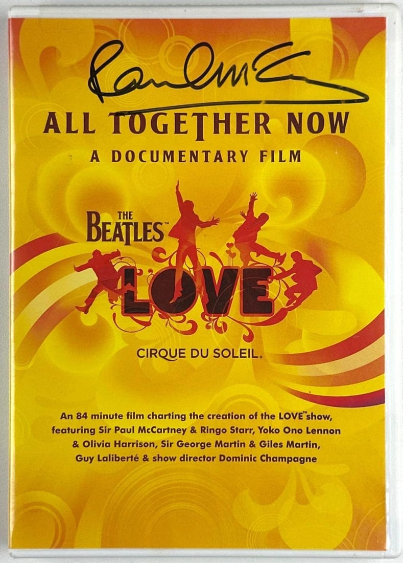 The Beatles: Paul McCartney Signed "All Together Now" DVD Documentary (Beckett): All Together Now DVD documentary, signed prominently at the top of the cover in black felt-tip marker by Paul McCartney, presenting a bold, full-name autograph. Measuring approximately 7.5" x 5.5"