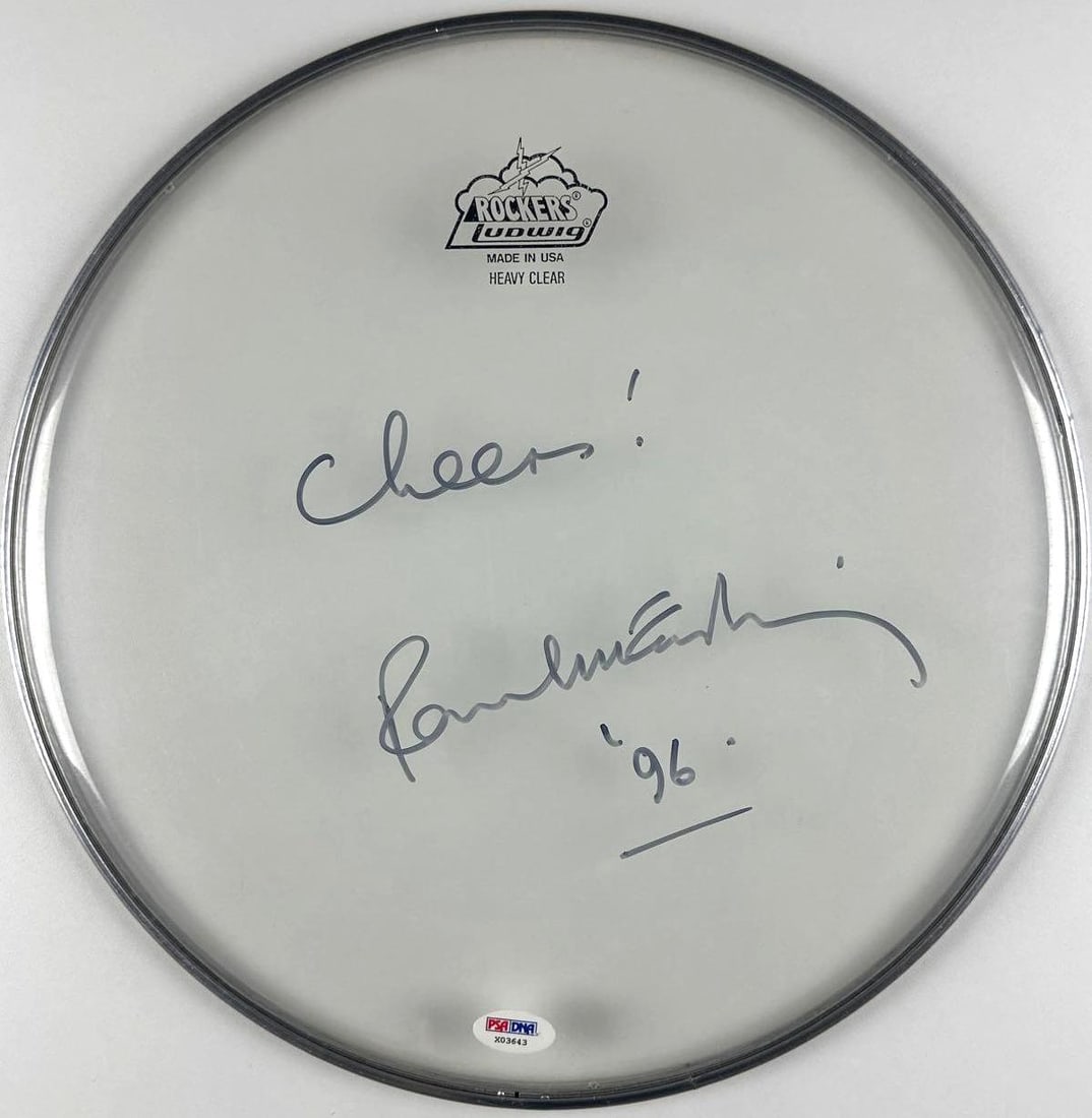 The Beatles: Paul McCartney Signed 13.5" Rockers Ludwig Clear Drumhead (PSA/DNA): Nice clear Rockers Ludwig drumhead, measuring approximately 13.5" x 13.5", signed prominently on the front in black felt-tip marker by Paul McCartney, who inscribed "Cheers!" before his signature and