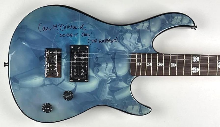 Star Wars: Ian McDiarmid Signed Jedi Custom Graphics Peavey Rockmaster Guitar: "Star Wars" Jedi custom graphics Stratocaster-style Peavey Rockmaster guitar signed on the body in black felt tip marker by actor Ian McDiarmid, who inscribed "So Be It Jedi (The Emperor)" after his s