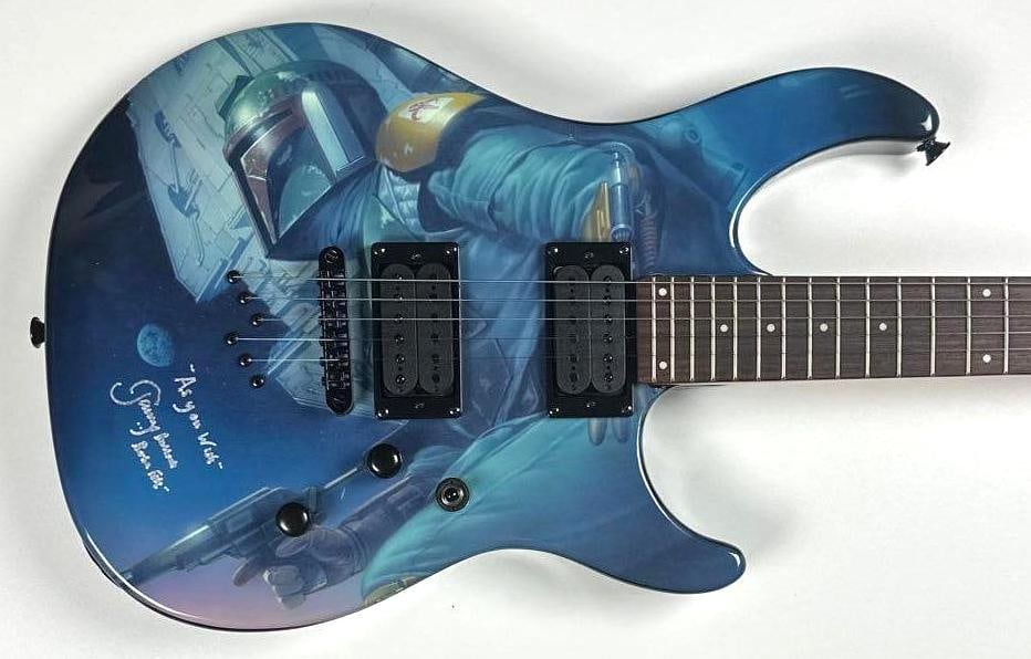 Star Wars: Jeremy Bulloch Signed Boba-Fett Custom Graphics Peavey Brand Stratocaster-Style Guitar: "Star Wars" Boba-Fett custom graphics Peavey brand Stratocaster-style guitar signed on the body in white paint pen by actor Jeremy Bulloch, who inscribed "As you wish" before his signature. Measuring 