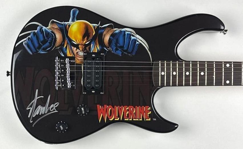 Marvel Avengers: Stan Lee Signed Wolverine Custom Graphics Strat-Style Peavey Rockmaster Guitar: Marvel X-Men Wolverine custom graphics Peavey Rockmaster electric guitar, signed prominently on the body in silver felt-tip marker by legendary Marvel writer and creator Stan Lee, co-creator of the