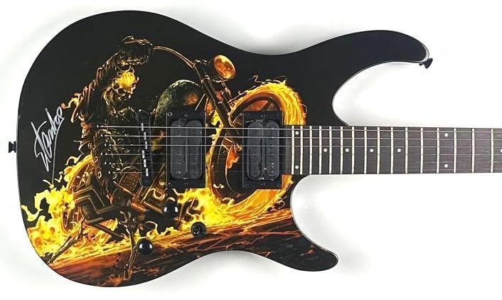 Marvel: Stan Lee Signed "Ghost Rider" Peavey Predator Guitar (Third Party Guaranteed): Ghost Rider custom graphics Peavey Predator electric guitar, signed prominently on the body in silver felt-tip marker by legendary Marvel creator Stan Lee. The guitar features striking Ghost Rider art