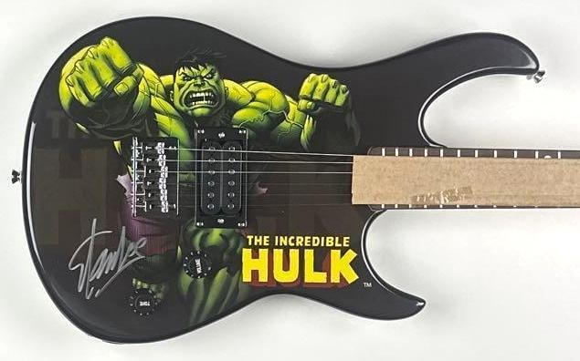 Marvel Avengers: Stan Lee Signed Hulk Custom Graphics Peavey Rockmaster Guitar: Marvel The Incredible Hulk custom graphics Peavey Rockmaster electric guitar, signed prominently on the body in silver felt-tip marker by legendary Marvel creator Stan Lee, co-creator of the Hulk.