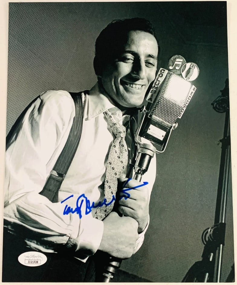 Tony Bennett Signed 10" x 8" Photo (JSA Authentication): Black-and-white 10" x 8" photo signed in blue felt tip marker by musician Tony Bennett. In fine condition. Authenticated by JSA, with their official hologram affixed to the front bottom left corner