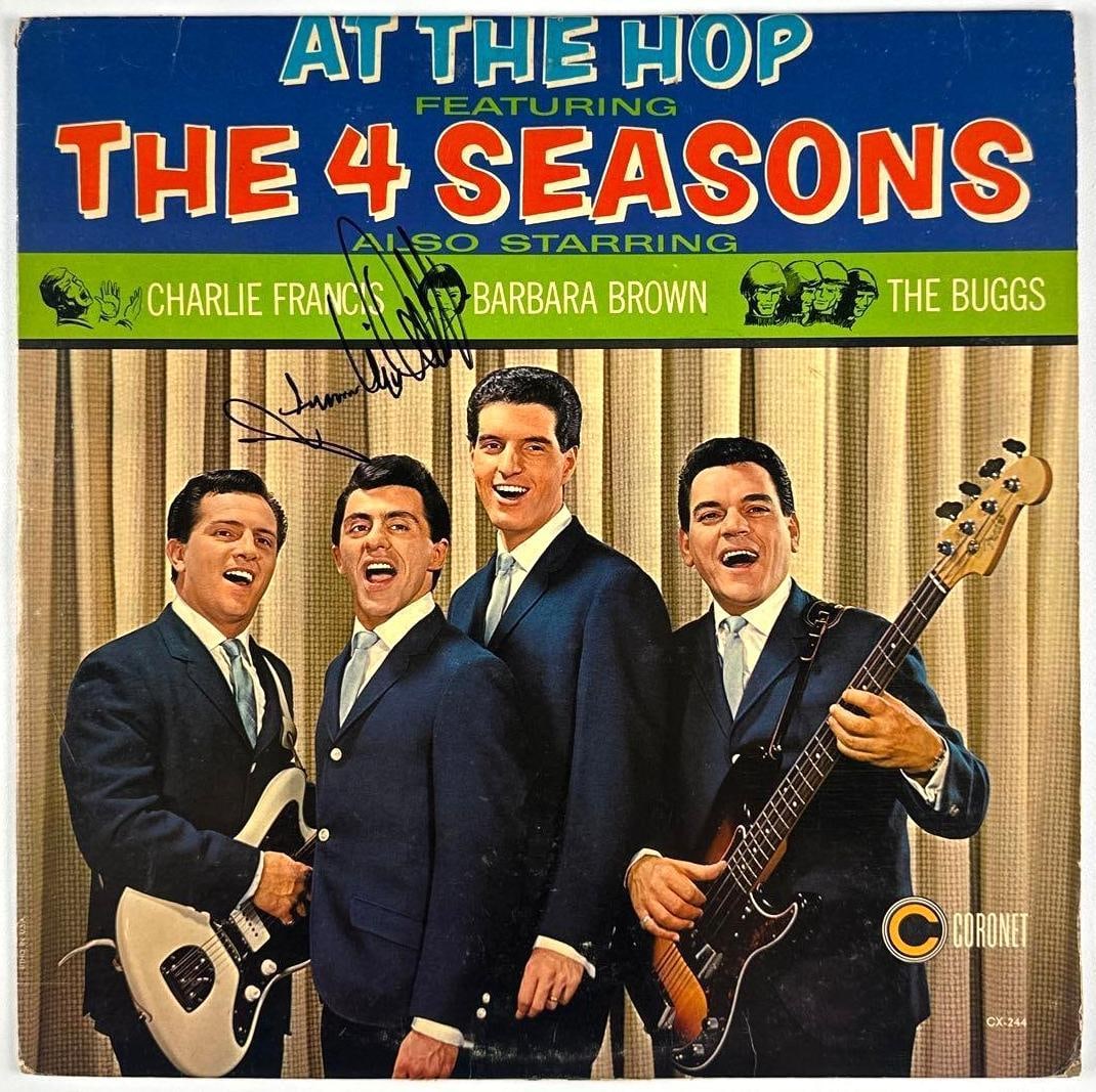 Frankie Valli Signed "At the Hop Featuring the Four Seasons" Album (Third Party Guaranteed): "At the Hop Featuring the Four Seasons" album signed on the cover in black felt tip marker by musician Frankie Valli. Measuring approximately 12" x 12" and in very good condition, with some signs of