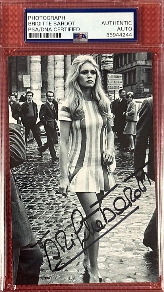 Brigette Bardot Signed 5.5" x 3.5" Photo (PSA/DNA Encapsulated): Black-and-white 5.5" x 3.5" photo signed in black felt tip marker by actress Brigette Bardot. In fine condition. Encapsulated and authenticated by PSA/DNA (#85944244).