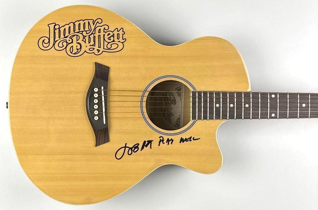 Jimmy Buffett Signed Acoustic Guitar w/ "Play Well" Inscription (Walls of Sound): Wooden Jimmy Buffett custom graphics Copley CA400 cutaway acoustic guitar, signed prominently on the body in black felt-tip marker by Jimmy Buffett, who added the inscription “Play Well” w
