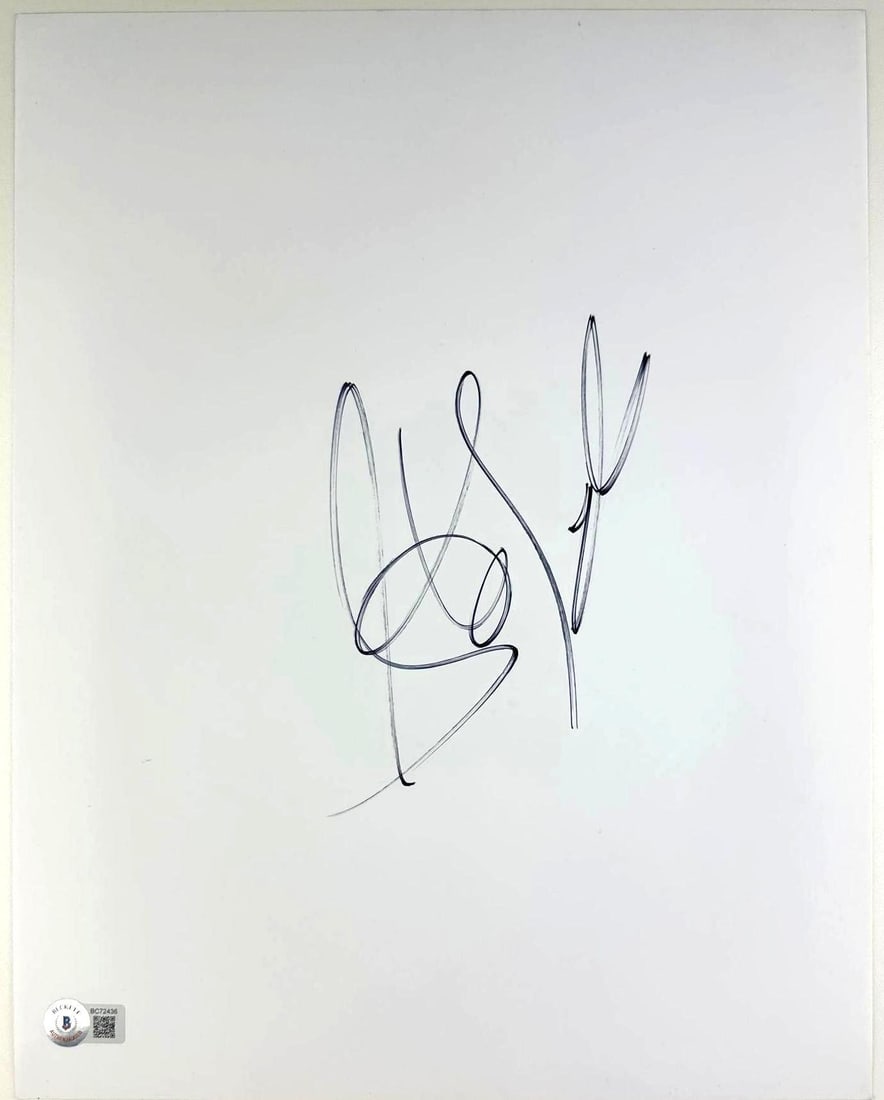 Aerosmith: Steven Tyler Signed 14" x 11" White Photo Sheet (Beckett Authentication): White 14" x 11" photo paper sheet signed in black felt tip marker by Aerosmith band member Steven Tyler. In fine condition. Accompanied by a Beckett COA (#BC72436). Obtained in-person.