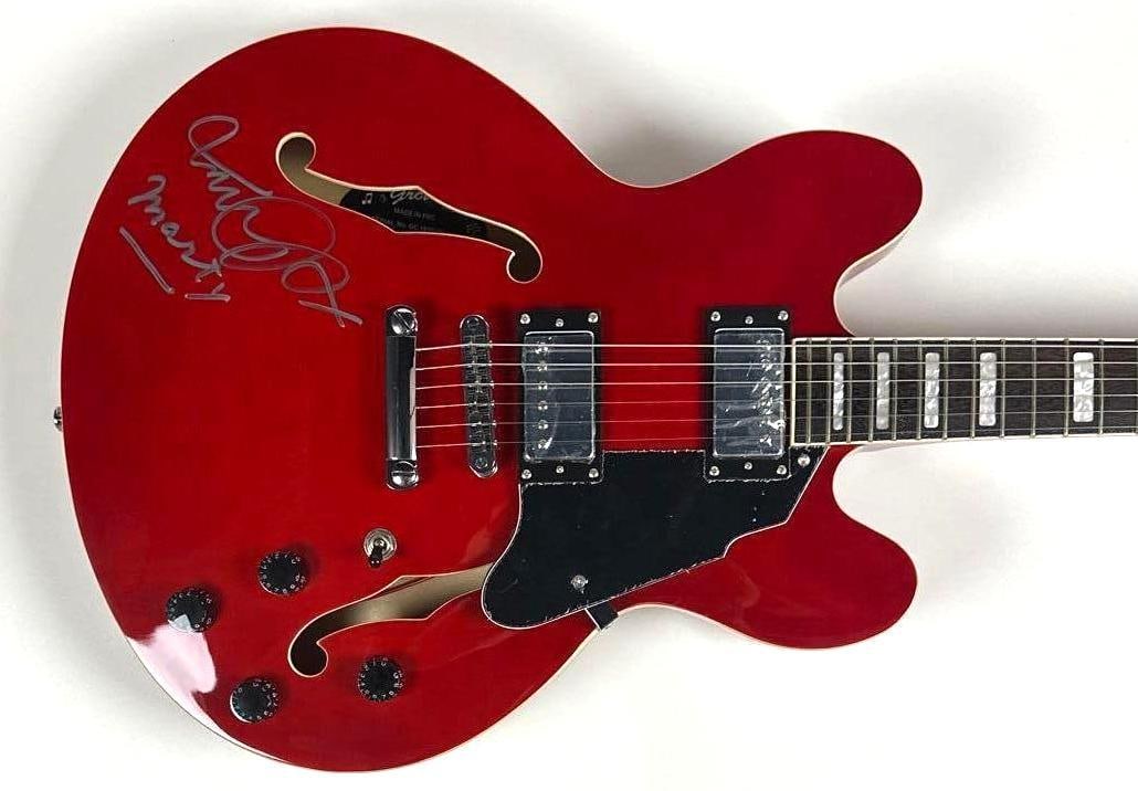 Back to the Future: Michael J. Fox Signed Squier Starfire Electric Guitar (Official Pix): Red Squier Starfire Grote brand electric guitar signed on the body in silver felt tip marker by "Back to the Future" actor Michael J. Fox, who inscribed his character's name "Marty" after his signatur