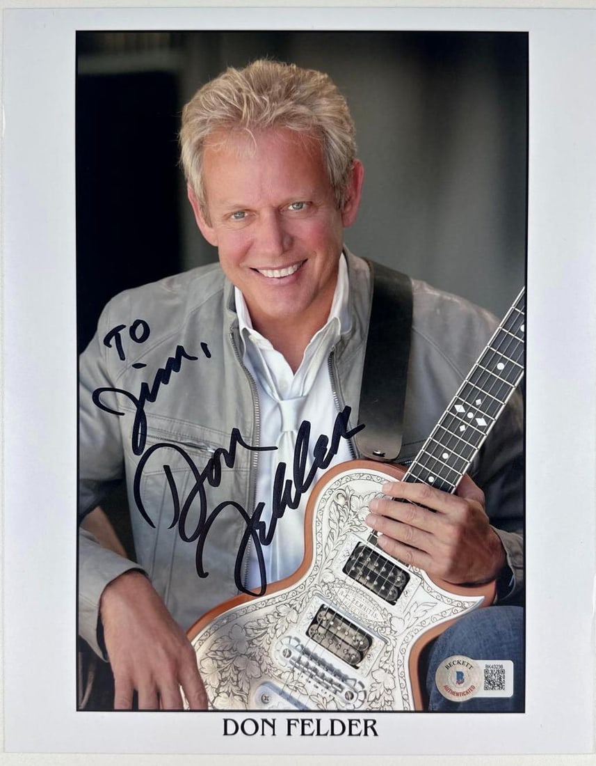 Eagles: Don Felder Signed 10" x 8" Press Photo (Beckett Authentication): Color 10" x 8" press photo signed in black felt tip marker by Eagles band member Don Felder, who inscribed "To Jim" before his signature. In fine condition. Authenticated by Beckett, with their