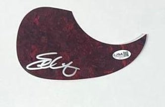 Eric Church Signed Teardrop Pickguard (JSA Authentication): Red-black color teardrop shape pickguard signed in silver felt tip marker by musician Eric Church. In fine condition. Accompanied by a JSA COA (#CK85307).