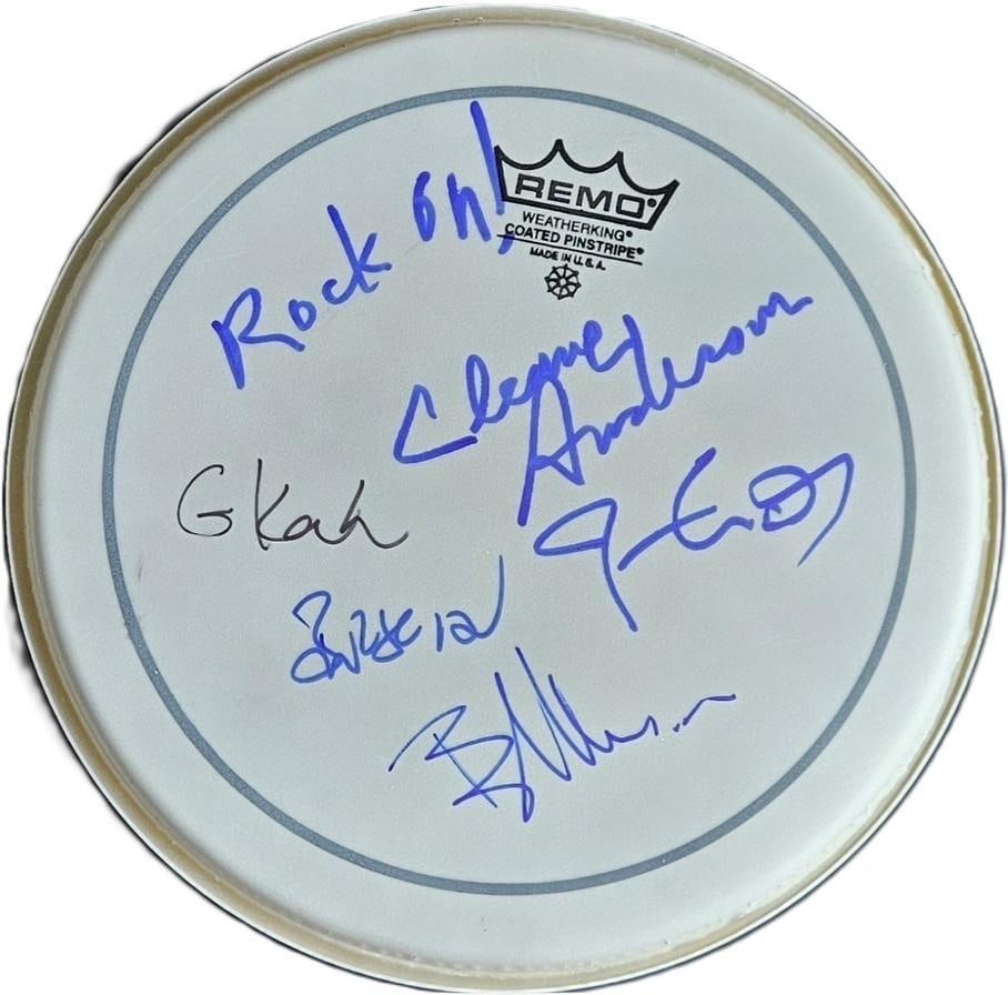 Blue Rodeo Fully Group Signed 10" Remo Brand Drumhead (5 Sigs) (Third Party Guaranteed): White 10" x 10" Remo brand drumhead signed on the front in blue and black felt tip markers by Blue Rodeo band members Jim Cuddy, Greg Keelor, Cleave Anderson, who inscribed "Rock on!" before his