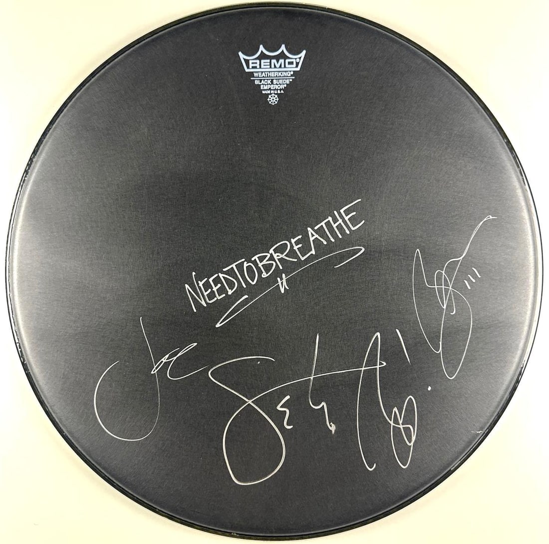 NEEDTOBREATHE Group Signed 16.5" Remo Brand Drumhead (2 Sigs) (Third Party Guaranteed): Black 16.5" x 16.5" Remo brand drumhead signed on the front in silver felt tip marker by NEEDTOBREATHE band members Bear Rineheart and Joe Stillwell. In fine condition. Provenance Eaton & Brennan Auct