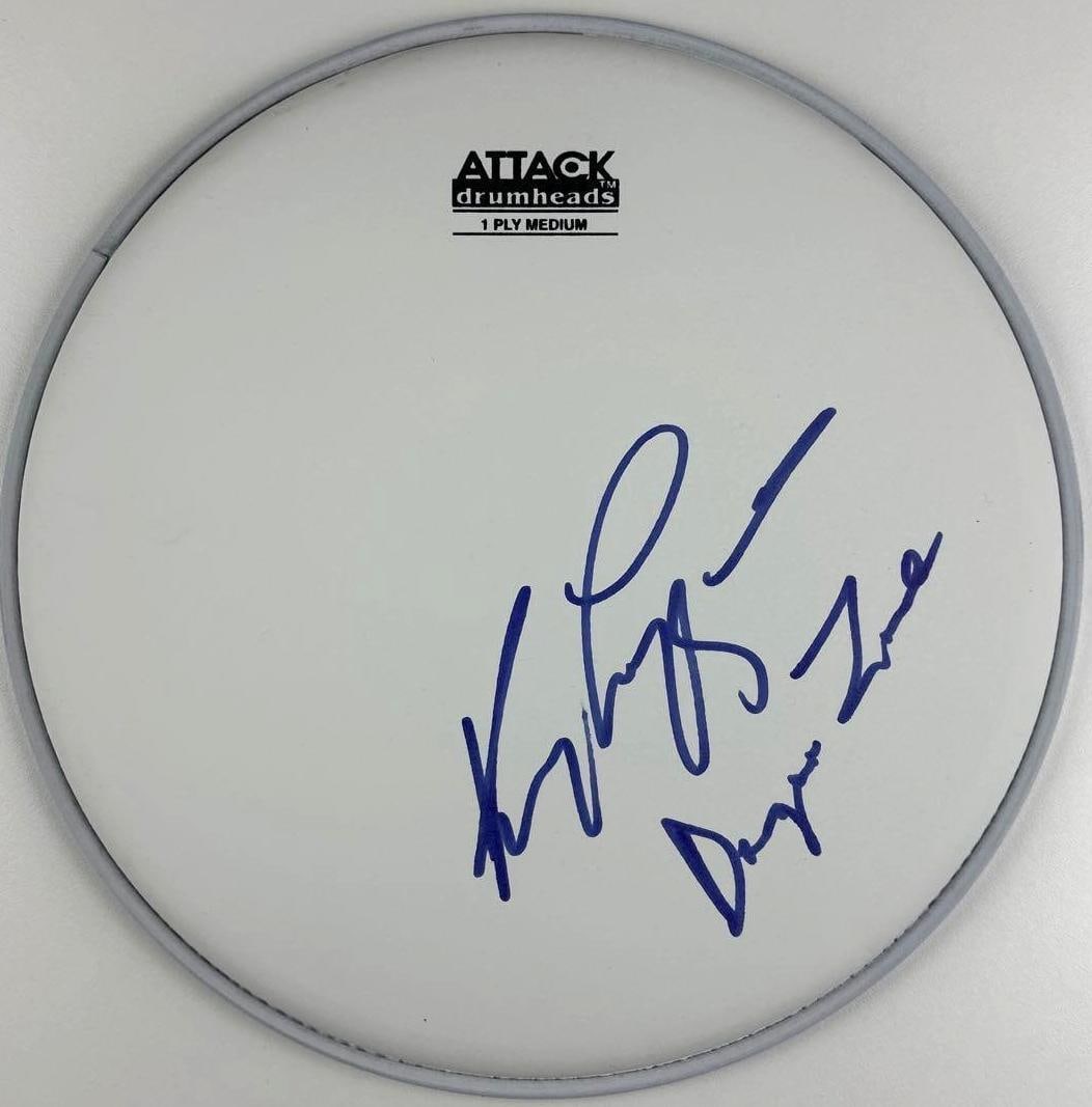 Kenny Loggins "Danger Zone" Signed 10" Attack Brand Drumhead (Third Party Guaranteed): White 10.5" x 10.5" Attack brand drumhead signed on the front in blue felt tip marker by country musicians Kenny Loggins who adds his song "Danger Zone." In fine condition. Provenance Eaton & Brennan