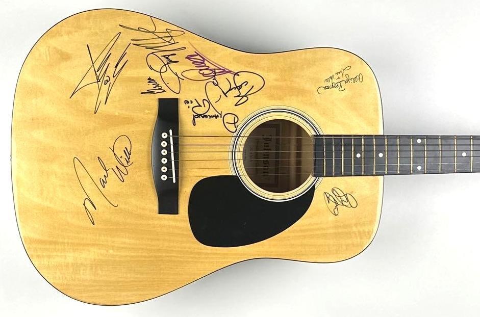 Diamond Rio Group Signed Acoustic Guitar (Third Party Guaranteed): Wooden Johnson acoustic guitar signed across the body in black felt-tip marker by Diamond Rio members Marty Roe, Jimmy Olander, Gene Johnson, Brian Prout, Dan Truman, and Dana Williams, one of whom