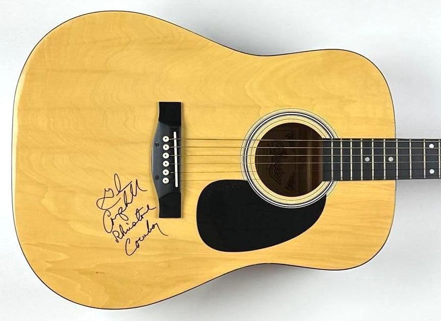 Glen Campbell Signed “Rhinestone Cowboy” Inscribed Copley Acoustic Guitar (Walls of Soun: Copley CA804 dreadnought-style acoustic guitar signed prominently on the body in black felt-tip marker by Glen Campbell. Measuring approximately 41" x 16" x 5" and in fine condition. Accompanied by a 