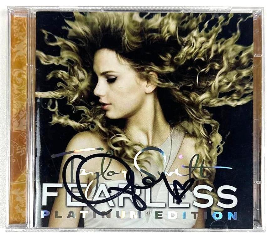 Taylor Swift Signed "Fearless" Platinum Edition CD (Third Party Guaranteed): "Fearless" platinum edition CD signed on the cover in black felt tip marker by musician Taylor Swift. Measuring approximately 5" x 5" and in fine condition. CD is included. Provenance Eaton & Brennan 