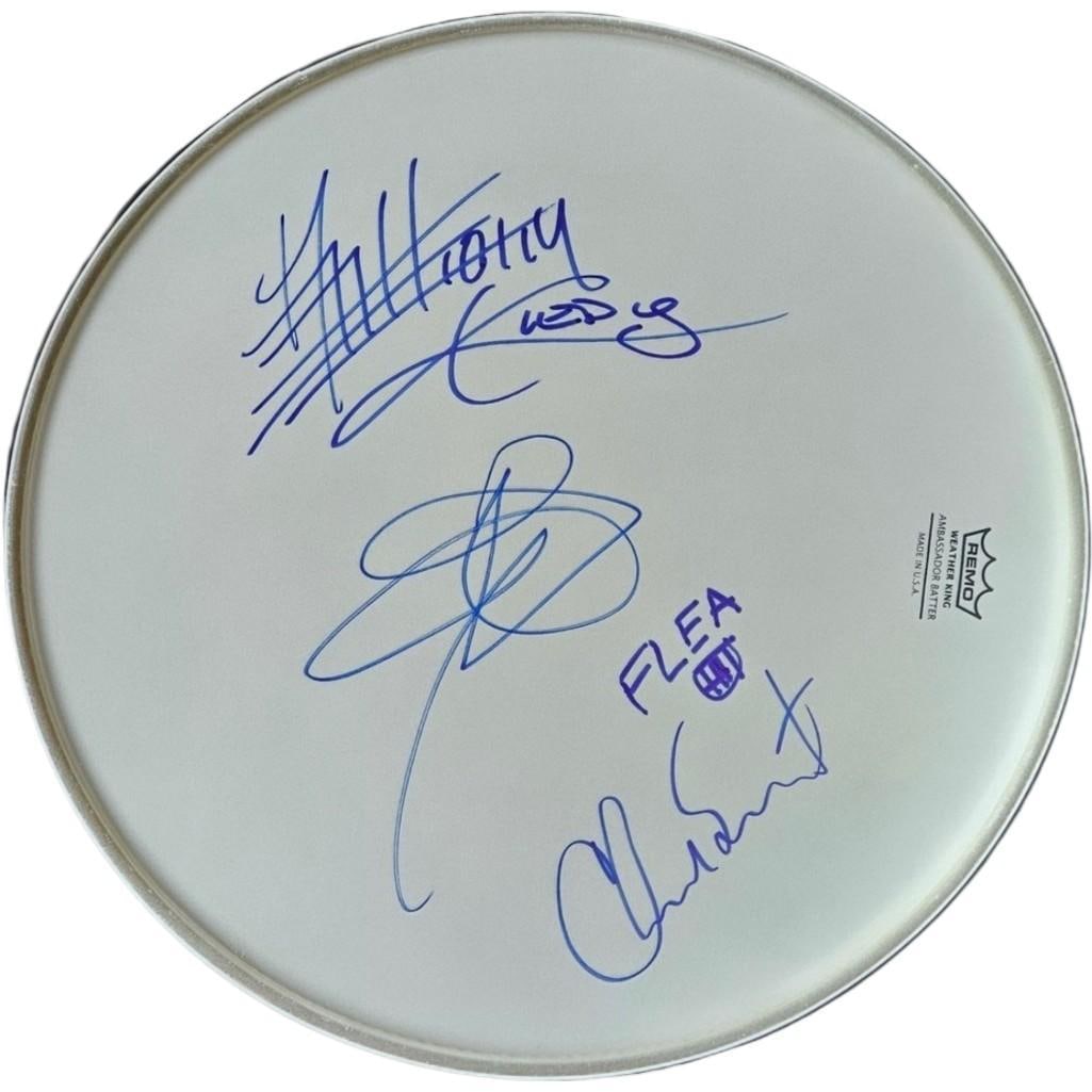 Red Hot Chili Peppers Fully Group Signed 14" Remo Brand Drumhead (4 Sigs) (Third Party): White 14" x 14" Remo brand drumhead signed on the front in blue felt tip marker by Red Hot Chili Peppers band members Anthony Kiedis, Flea, Chad Smith, and John Frusciate. In fine condition. Obtained