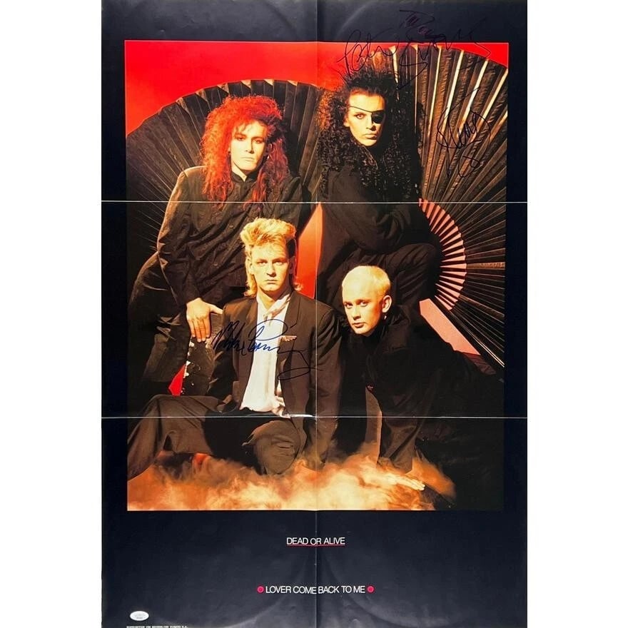 Dead or Alive Group Signed 36" x 24" "Lover Come Back" UK Poster (4 Sigs) (JSA Authentication): Color 36" x 24" "Lover Come Back" UK poster signed in blue felt tip marker by Dead or Alive band members Mike Percy, Steve Coy, Pete Burns, and Tim Lever. In very good condition, with some signs of