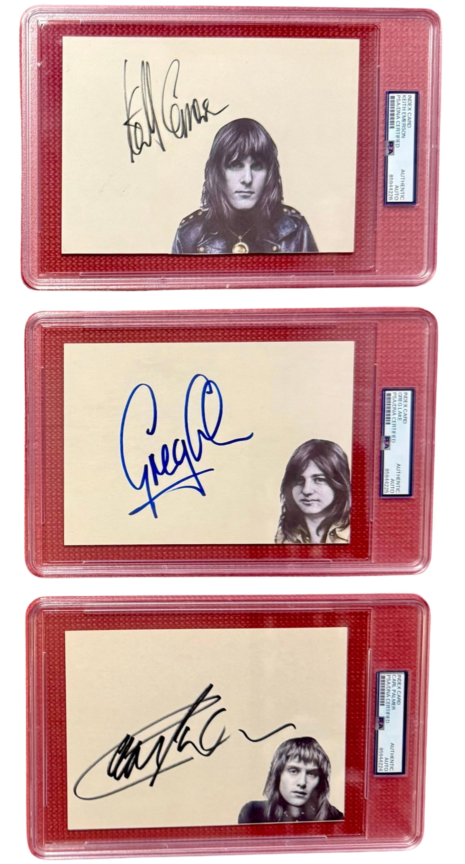 Emerson Lake & Palmer Signed Group Lot of (3) Index Cards (3 Sigs) (PSA/DNA Encapsulated): Group lot of (3) white paper 5" x 7" index cards. First card signed in black felt tip marker by Emerson Lake & Palmer band member Keith Emerson. In fine condition. Encapsulated and authenticated by PS