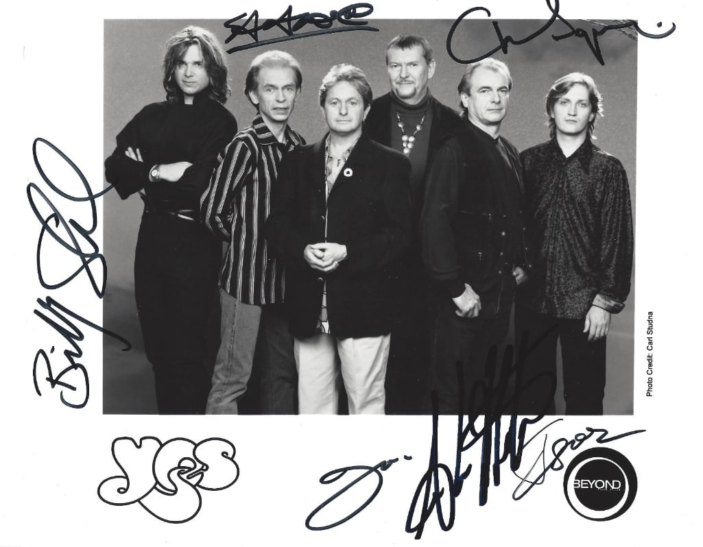 YES Group Signed 8" x 10" Promo Photo (6 Sigs) (ACOA Authentication): Black-and-white 8" x 10" promotional photo signed in black felt tip marker by YES band members Chris Squire, Steve Howe, Jon Anderson, Billy Sherwood, Igor Khoroshev, and Alan White. In fine
