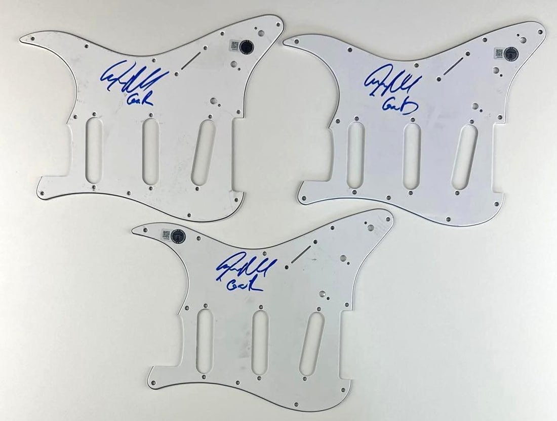 Guns N' Roses: Steven Adler Signed Group Lot of (3) Pickguards (Beckett Authentication): Group lot of (3) white 9" x 11" stratocaster-style pickguards signed on the front in blue felt tip marker by Guns N' Roses band member Steven Adler, who added "GnR." All signed upside-down and in