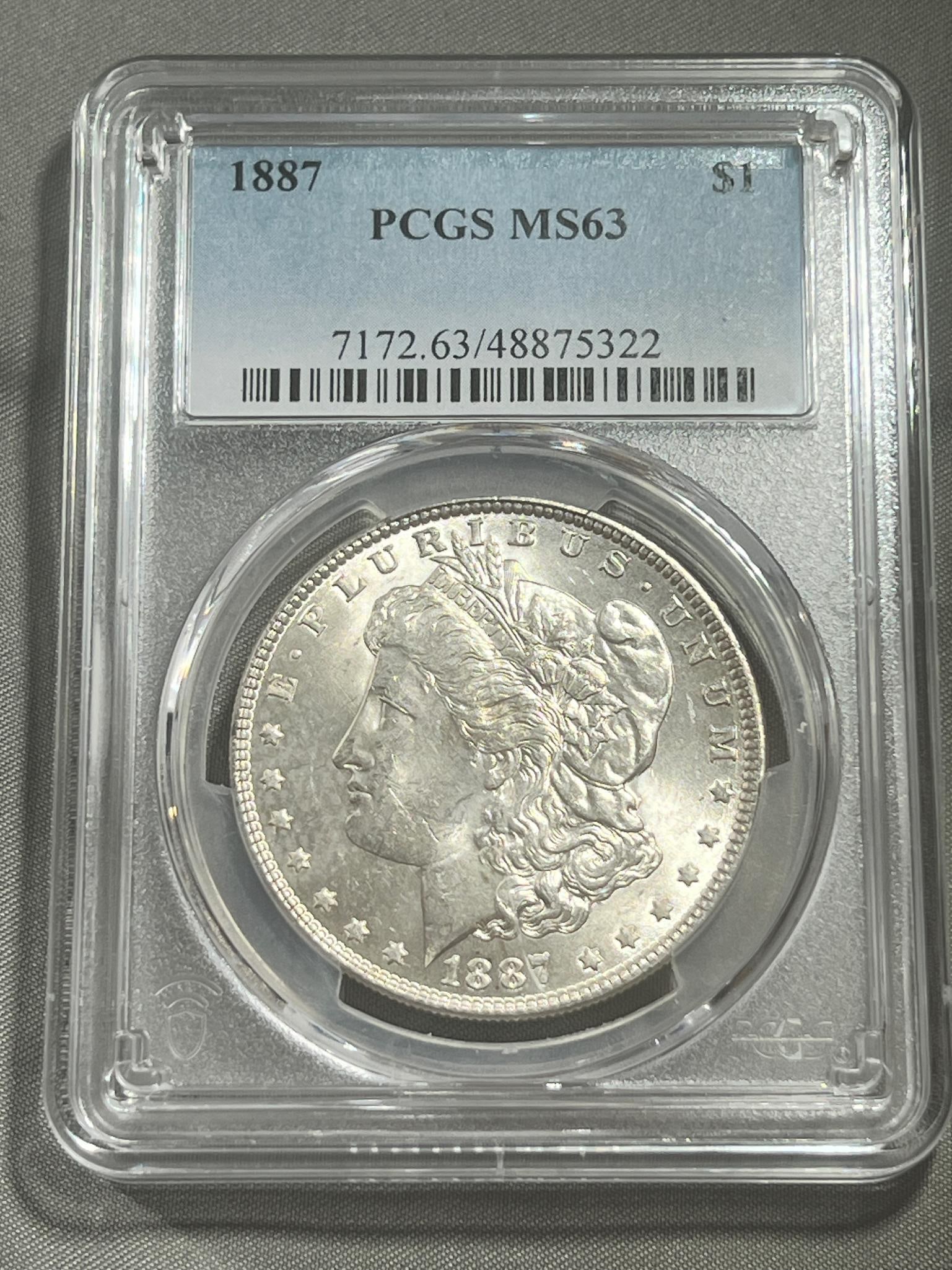 1887 Morgan Silver Dollar graded MS63 in PCGS holder (1 of 3)