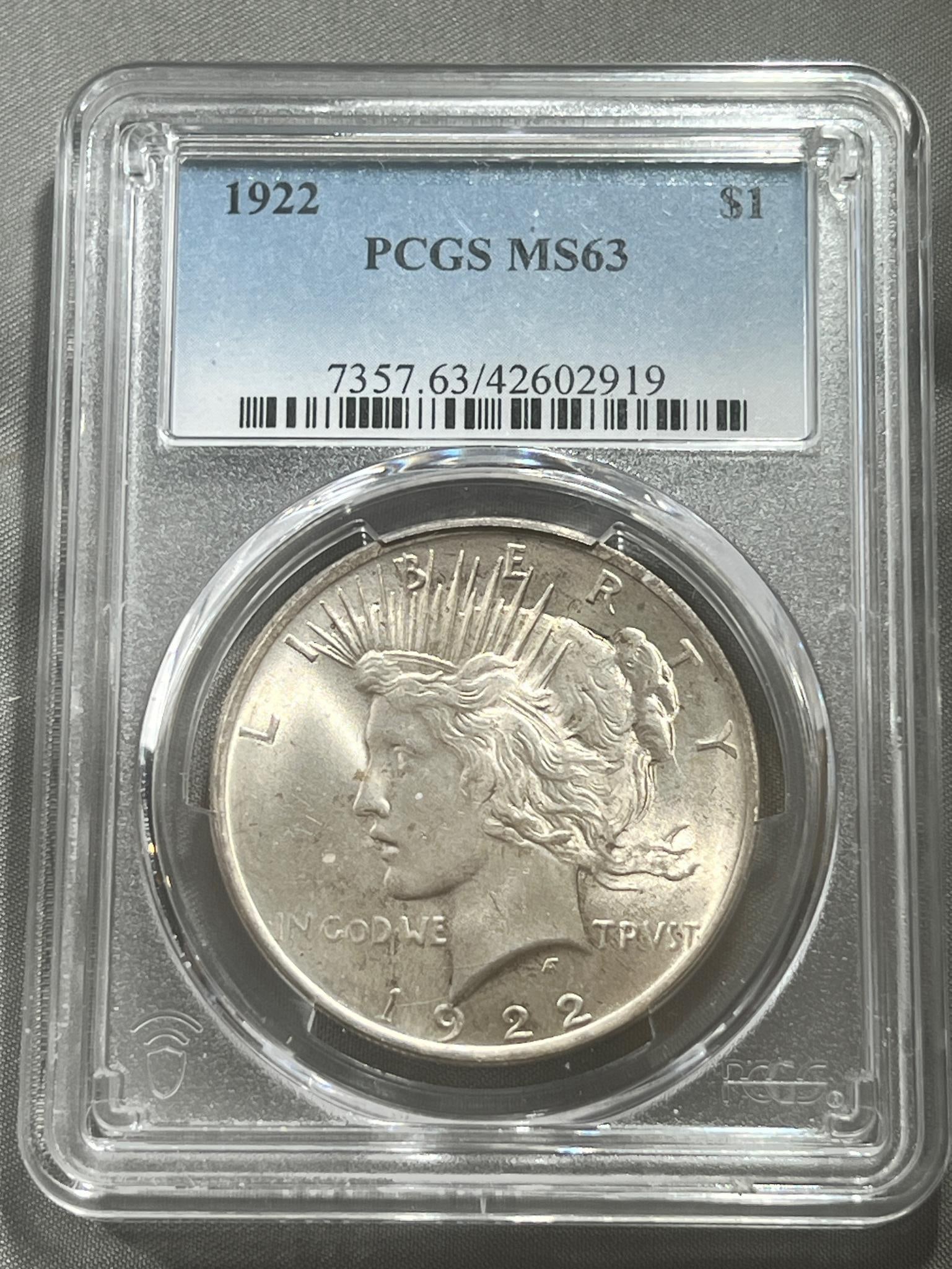 1922 Peace Silver Dollar graded MS63 in PCGS holder (1 of 3)