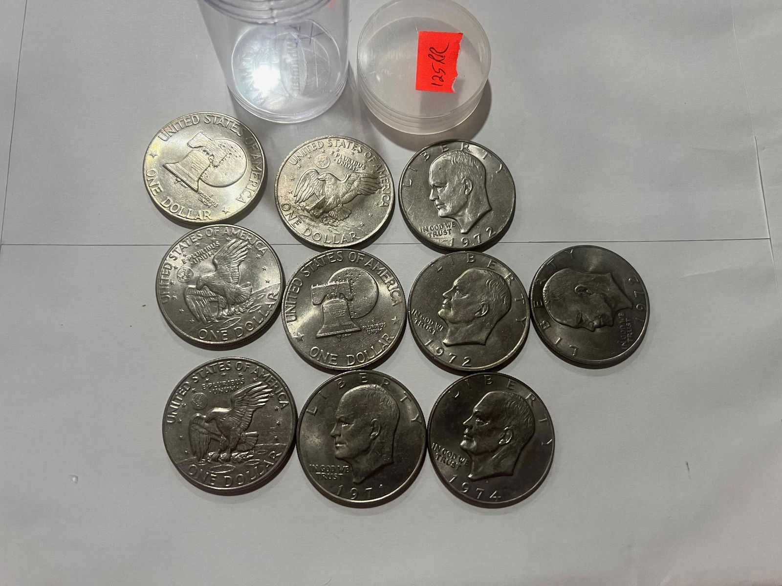 10- Asst. date Eisenhower Dollar coins w/ coin tube (1 of 1)