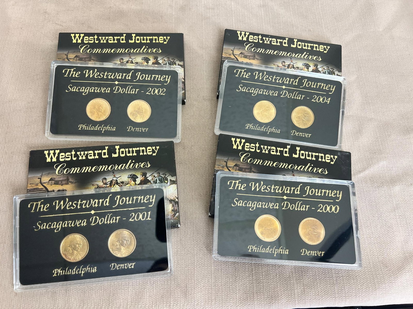 4- Sacagawea Westward Journey Dollar coin sets, 2000, 2001, 2002, and 2004 (1 of 5)