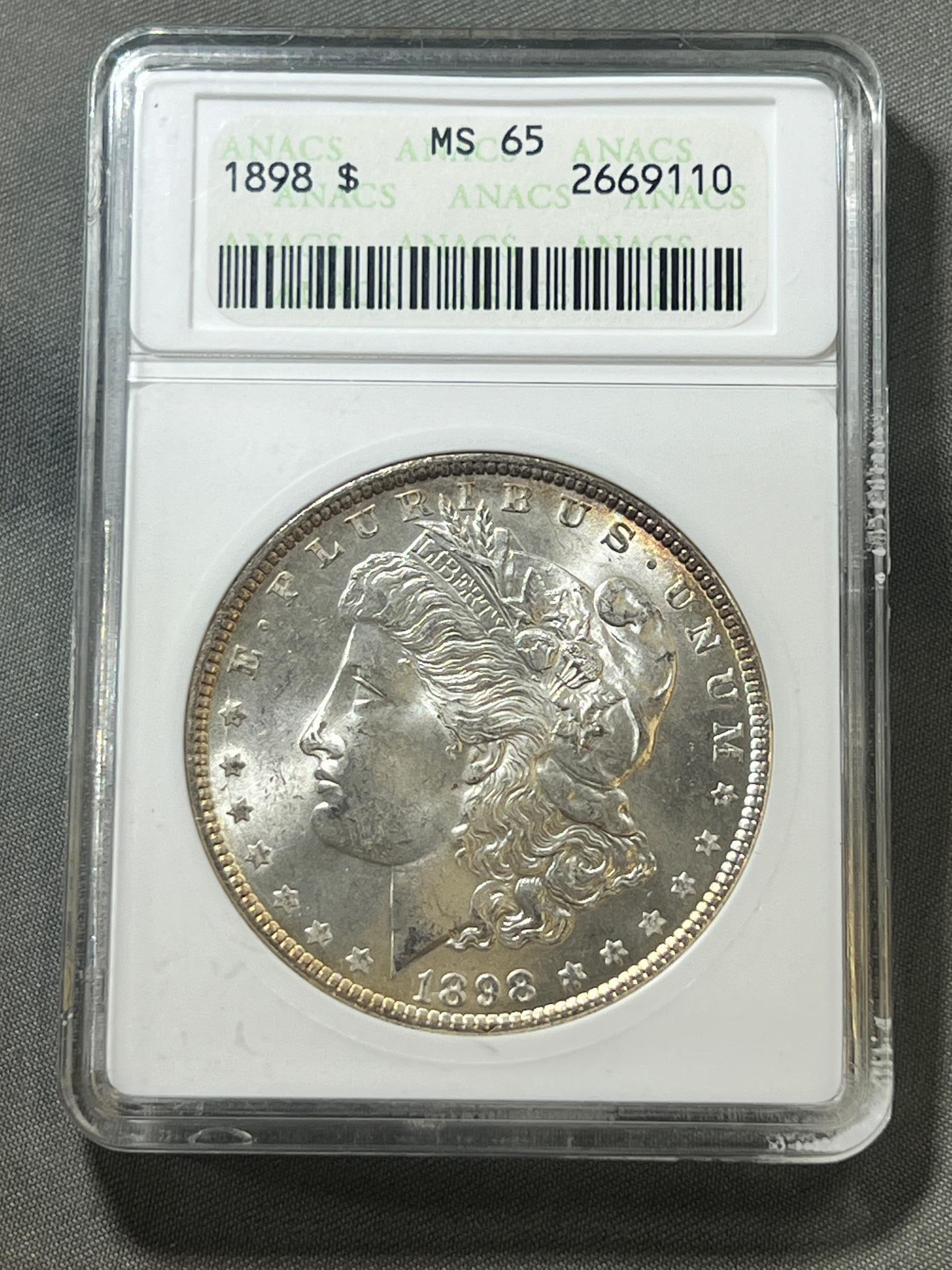 1898 Morgan Silver Dollar in MS65 ANACS Holder: Please see all pics for condition, grade, and completeness of albums. Please ask questions if you have them and request additional photos if necessary.