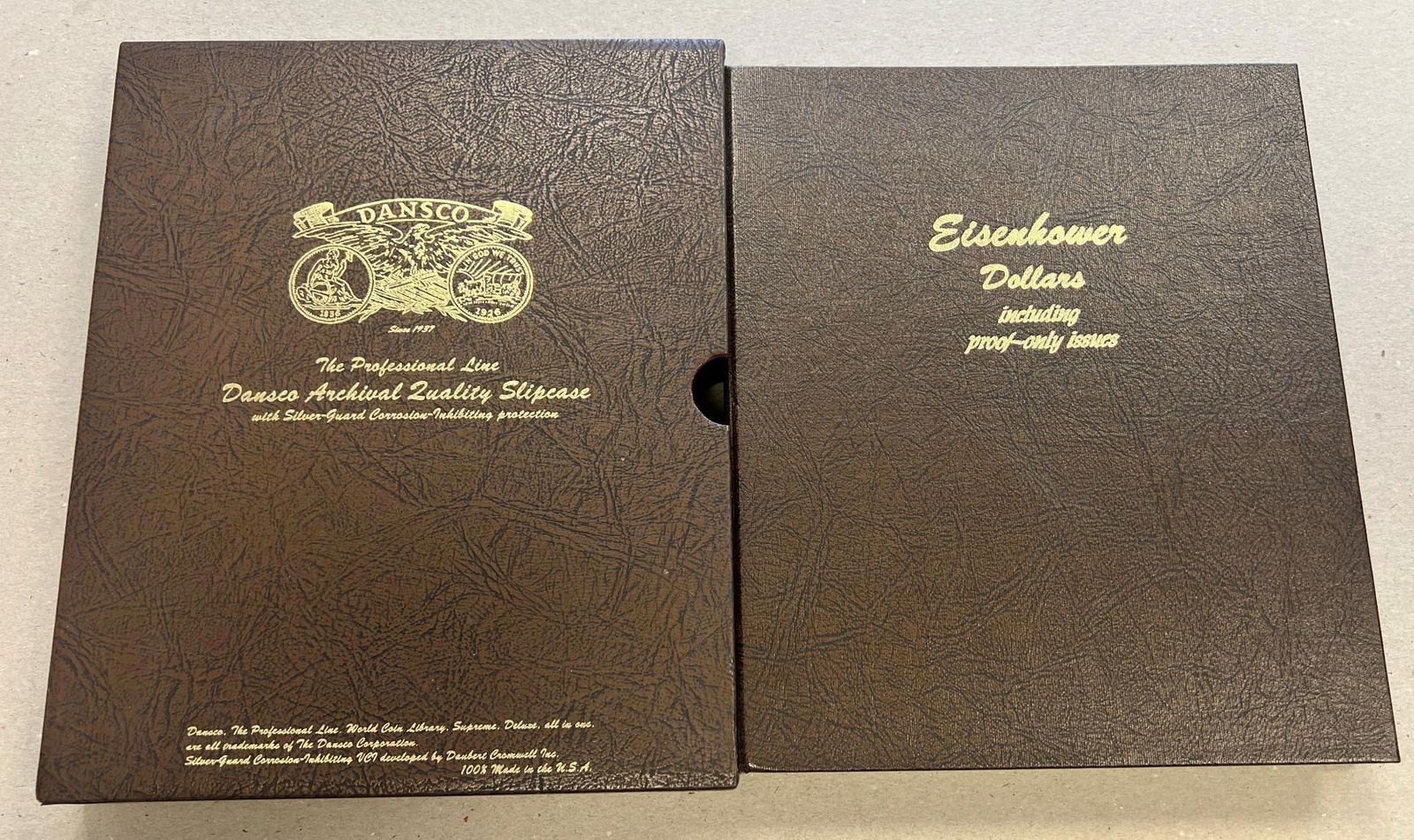 Eisenhower Dollar set in Dansco Album w/ slip cover, missing a few, includes 31 coins total (1 of 5)