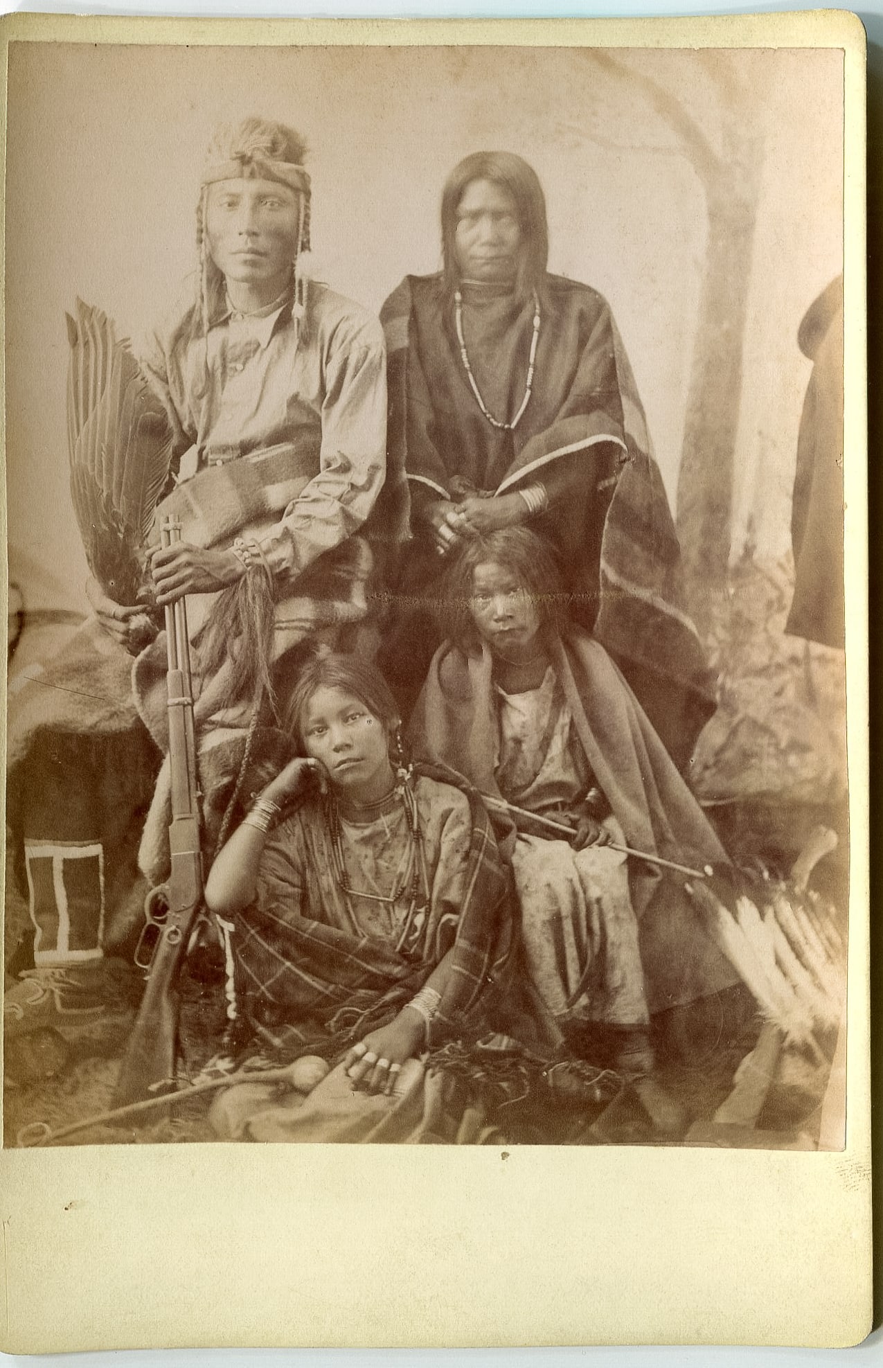 Cabinet Card of Native American Family with "He-Y-A-Tim" on Back: A captivating cabinet card featuring a Native American family, with the intriguing inscription "He-Y-A-Tim" on the back. The are most likely Cree Indians. This evocative image offers a poignant glimps