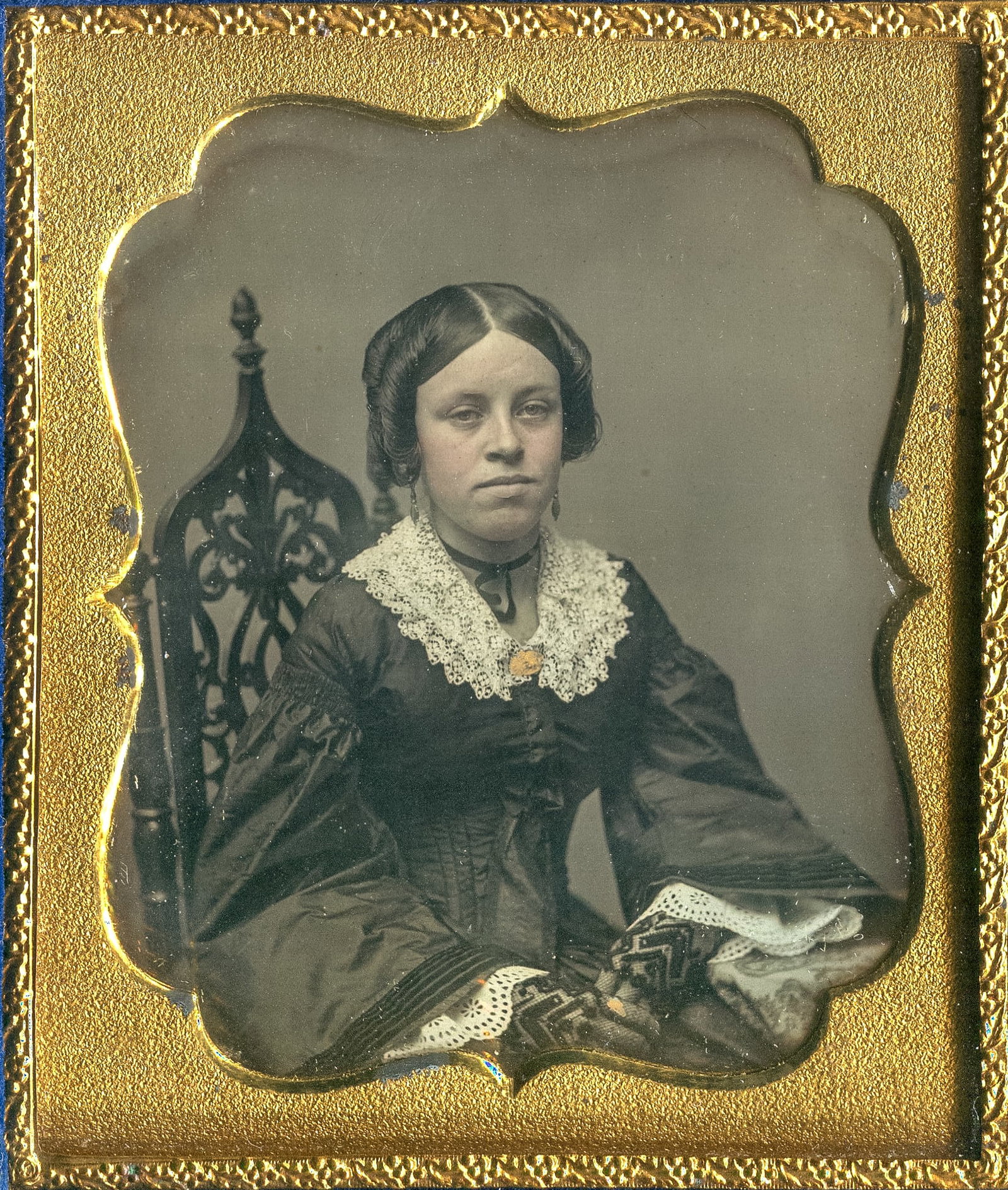 Daguerreotype of a Beautiful Woman in Lace Glove: A mesmerizing sixth plate daguerreotype capturing the timeless beauty of a woman adorned in lace glove, gracefully seated in a gothic studio chair. In this exquisite image, preserved with unparalleled
