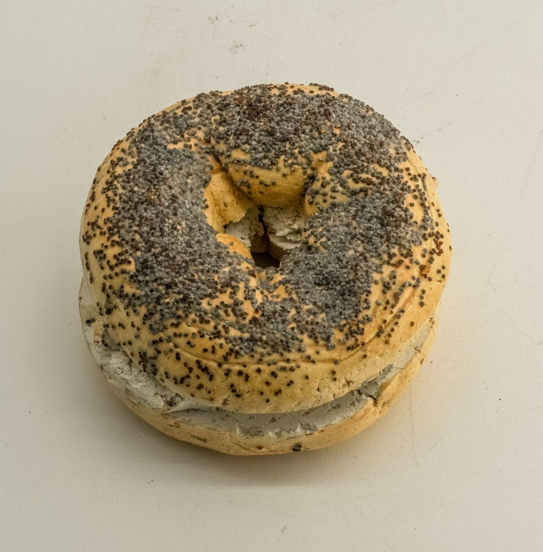 David James Gilhooly, "Poppy Seed Bagel with Cream Cheese": The "Poppy Seed Bagel with Cream Cheese" sculpture by David James Gilhooly in 1977 is a charming and whimsical creation that combines the artist's signature style with a playful exploration of everyda