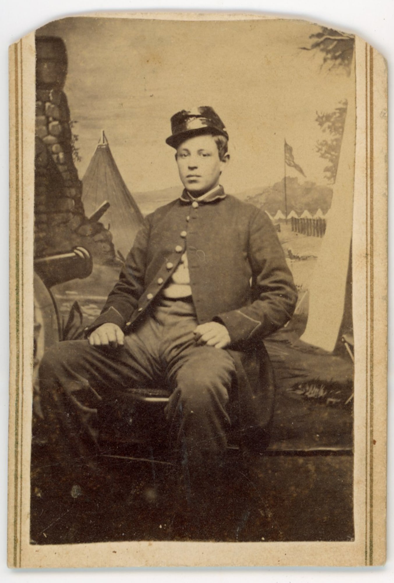 CDV of Seated Civil War Soldier with Painted Backdrop (1 of 2)
