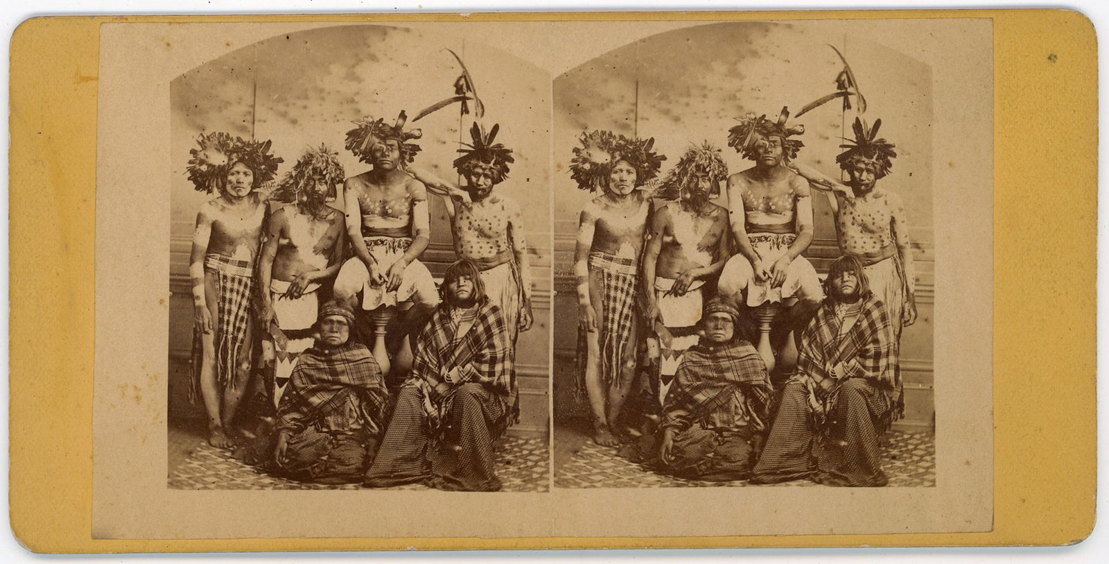 Stereoview Lower California Kumeyaay (Tipai) by Parker, San Diego: Studio portrait stereoview is one of the earliest depictions of the Kumeyaay (Tipai) people of northern Baja California and southern California. This image depicts six members of posed in elaborate ce