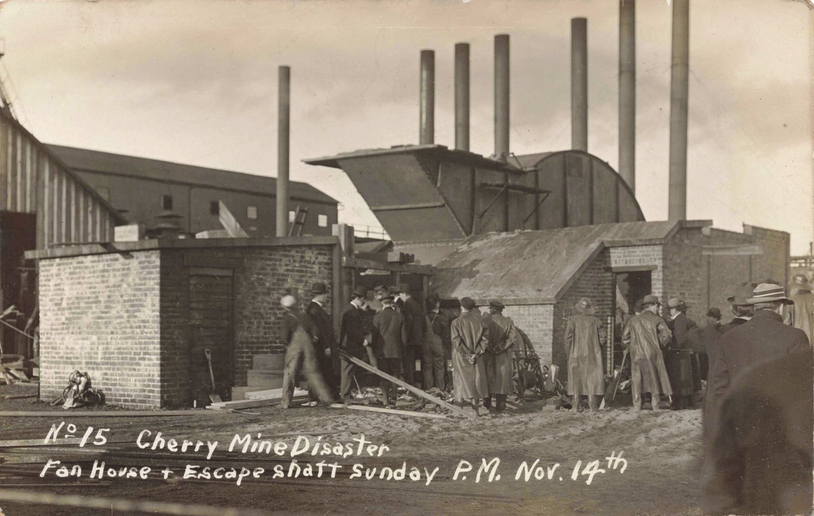RPPC 1909 Cherry Mine Disaster #15 Fan House: Real photo postcard showing the Cherry Mine disaster site identified as the fan house and escape shaft, with a clear front caption dated Sunday P.M. Nov. 14. Real photo process on postcard stock. The