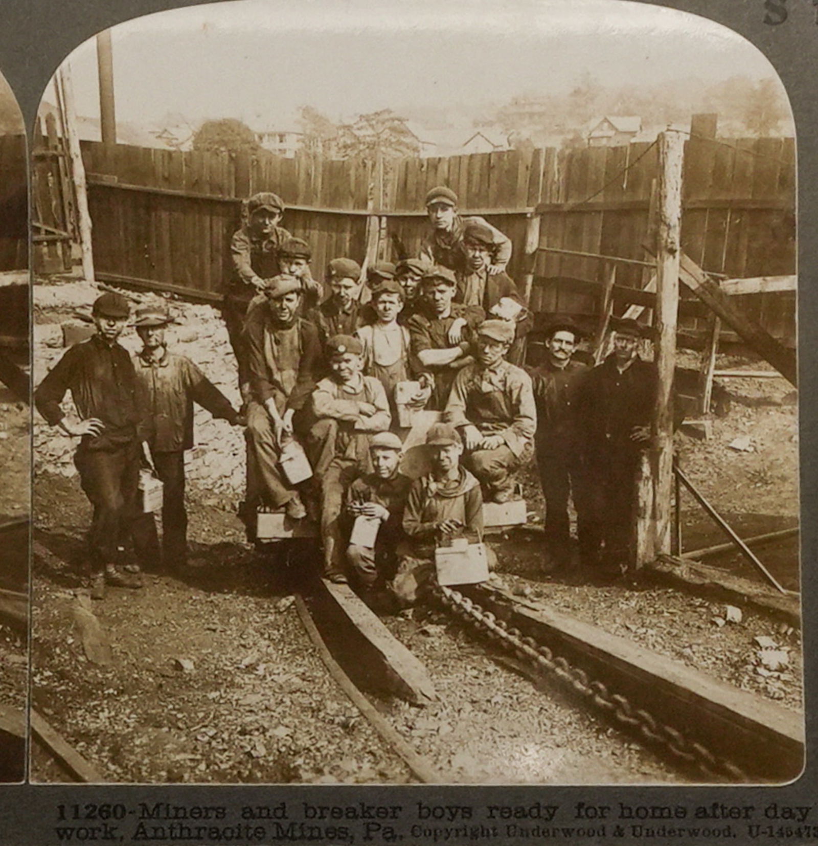 Anthracite Miners and Breaker Boys Stereoview: Stereoview photograph titled “Miners and breaker boys ready for home after day’s work, Anthracite Mines, Pa.” The image shows a group of miners and young breaker boys gathered at the entranc