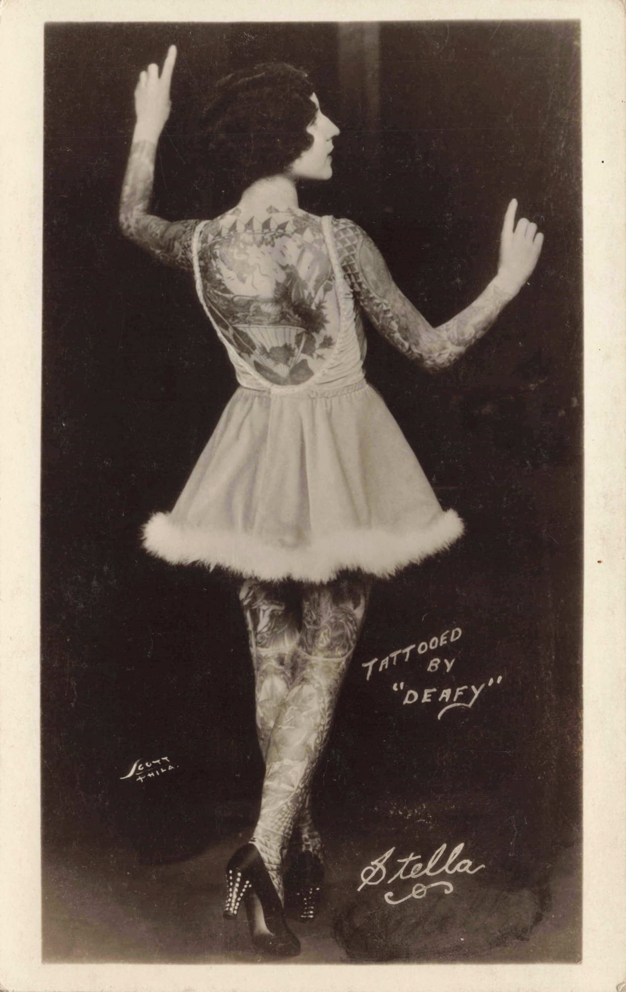 RPPC Deafy & Stella Tattooing Artists: Real photo postcard of “Stella,” with in-image text “Tattooed by ‘DEAFY’” and the name “Stella” at the lower edge. Stella (aka Edith Grassman) was the wife of famous tattoo