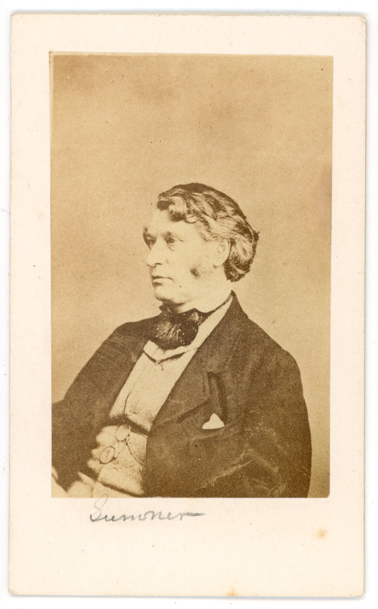 CDV Charles Sumner Signed Portrait: Carte de visite portrait of Charles Sumner, the prominent Massachusetts senator and outspoken abolitionist associated with the Civil War era. The image shows Sumner in profile wearing a dark coat and