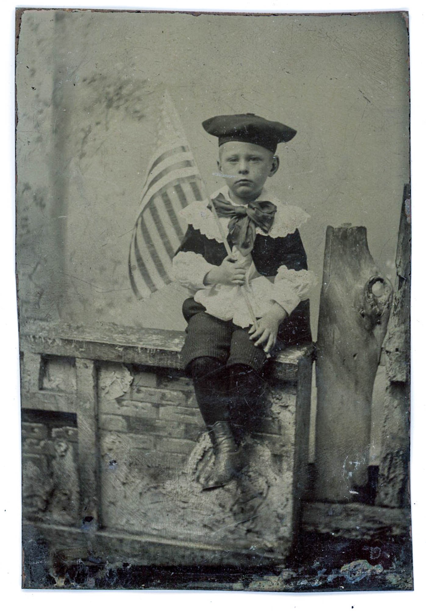 Tintype, Young Boy with American Flag, Seated on Fence (1 of 1)