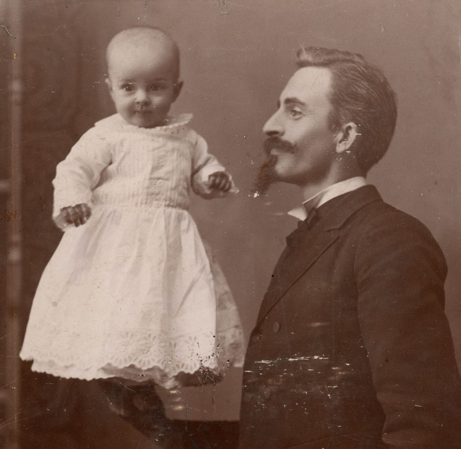 Cabinet Card, Man Balancing Infant Edith May, F. B. Way, Ashtabula (1 of 3)