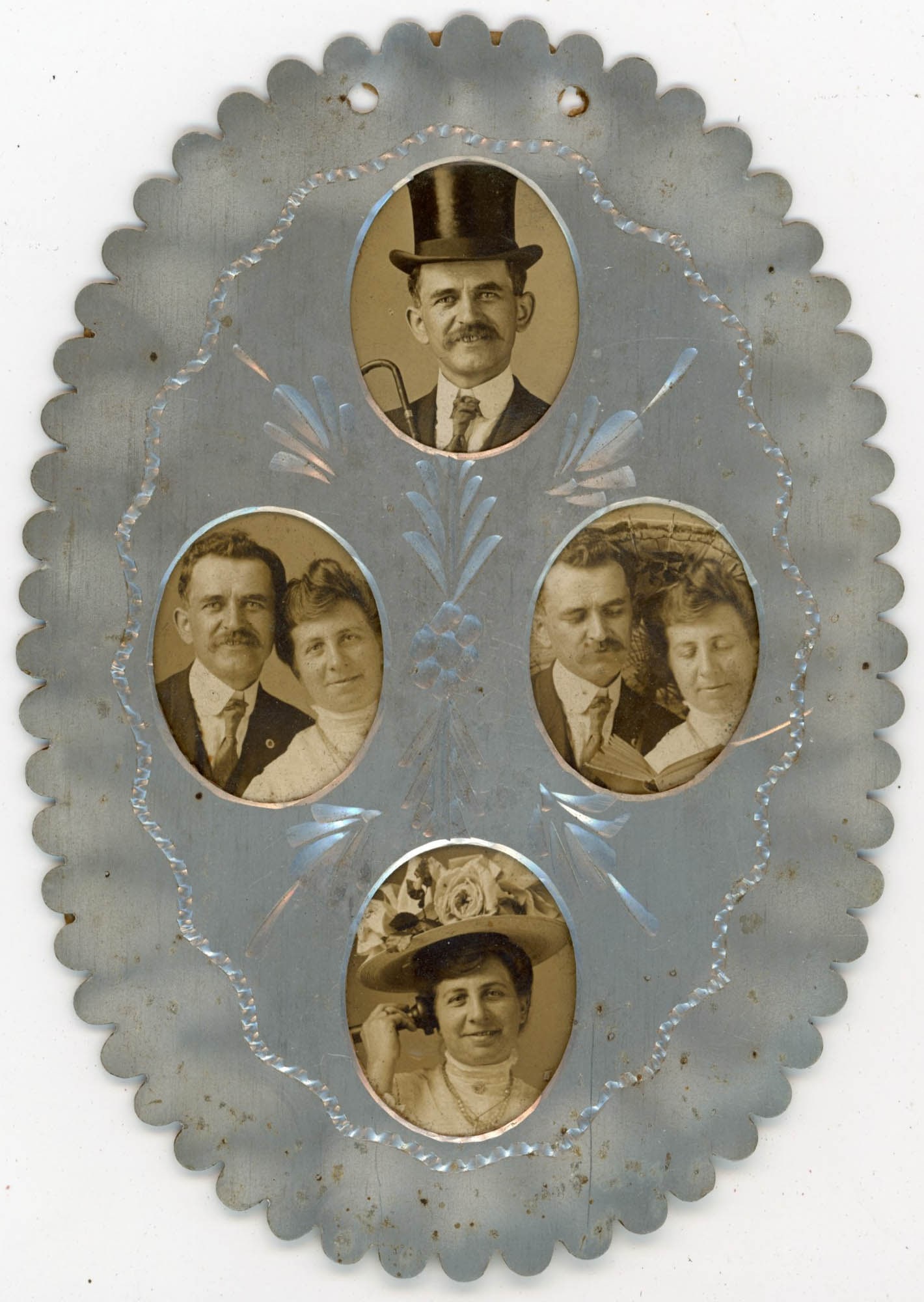 Aluminum Photo Frame, Five Portrait Ovals, Unidentified Group: Five oval bust portraits of unidentified adults are set into a die-cut scallop-edged aluminum novelty frame of oval form, produced circa 1900 to 1915, with two pierced hanging holes at the top and an 